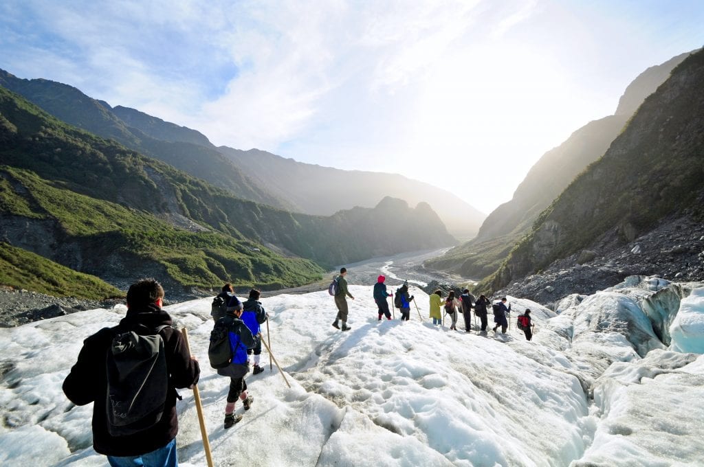 Tourists hiking on the Fox Glacier, New Zealand
